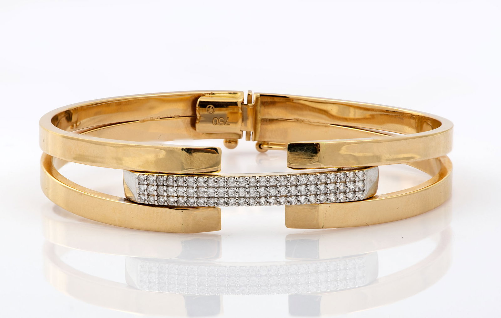 An 18K Gold and Zirconia Bangle Bracelet (1 of 4)