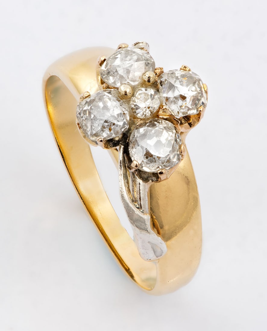 A 14K Yellow Gold and Diamond and Zirconia Ring: A 14K Yellow Gold and Diamond and Zirconia Ring Set with four old cut diamonds (approx. 0.6 Ct in total) and a zirconia stone. Acid tested.Weight: 5.88 gr; ring size: 8.5Condition: For a full conditio