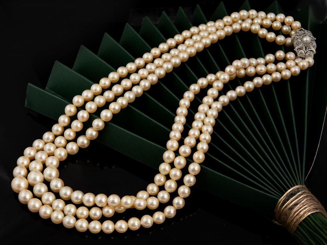 An 18K White Gold and Pearl Three Strand Necklace (1 of 3)