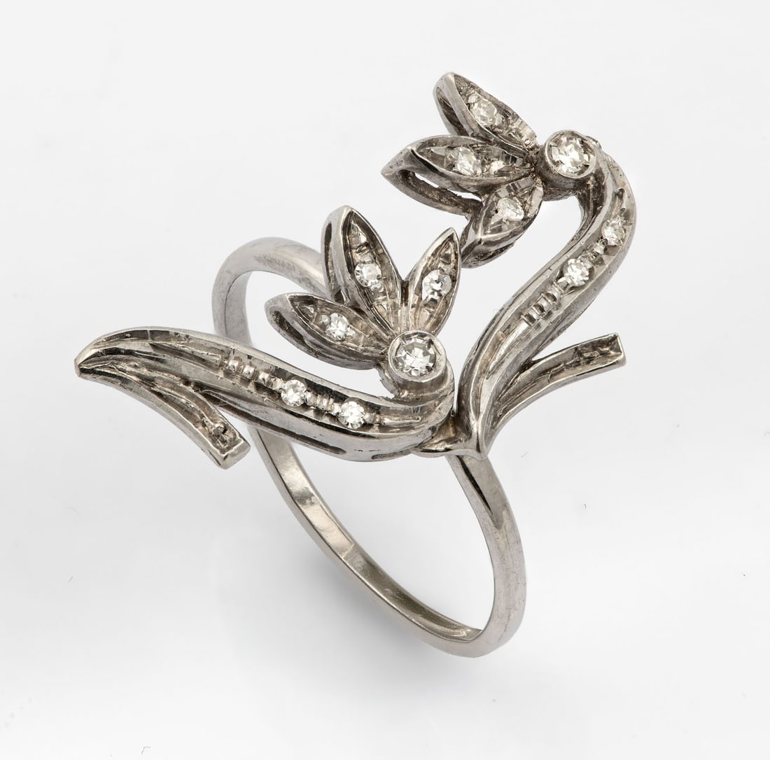A 14K and 18K White Gold and Diamond Ring: A 14K and 18K White Gold and Diamond Ring With a 14K white gold band and an 18K white gold top element designed as a biomorphic motif set with small diamonds (approx. 0.1 Ct total). Acid tested.Ring s