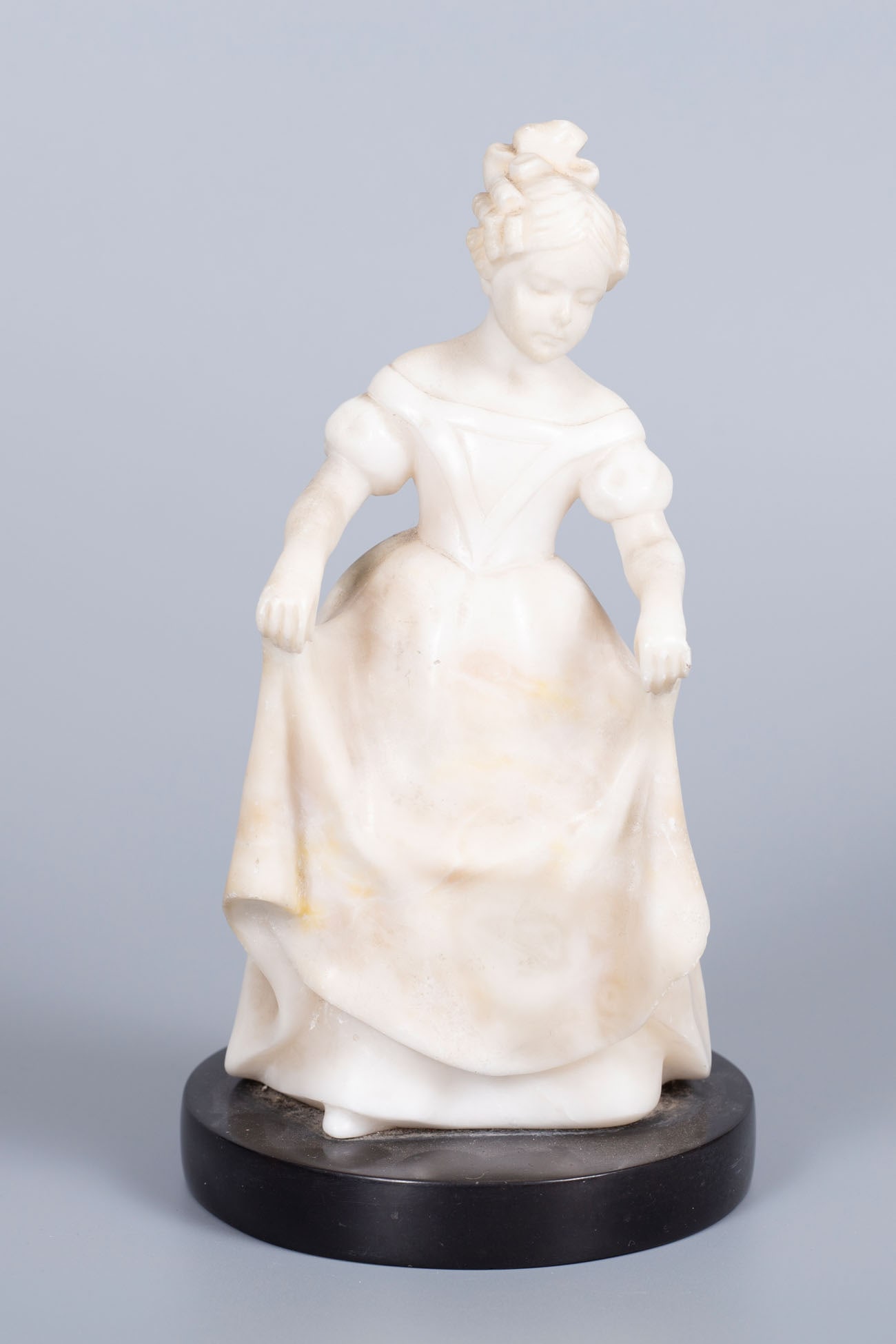 A Goldscheider White Marble Figurine, Vienna, Early 20th Century: A Goldscheider White Marble Figurine, Vienna, Early 20th Century Marked with an impressed stamp, artist's signature and numbering.Height: 23 cm; base diameter: 11 cm.Condition: For a full condition re