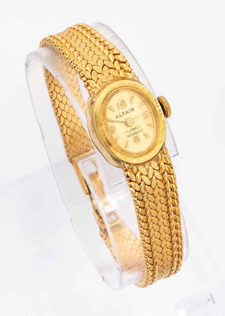 An ALTAIR 14K Yellow Gold Ladies' Wristwatch, 1970s: An ALTAIR 14K Yellow Gold Ladies' Wristwatch, 1970s Movement: Manual wind Case: Oval 14K yellow gold, hallmarked and acid tested Dial: cream with sweeping baton marks Band: Gold link bracelet, hallmar