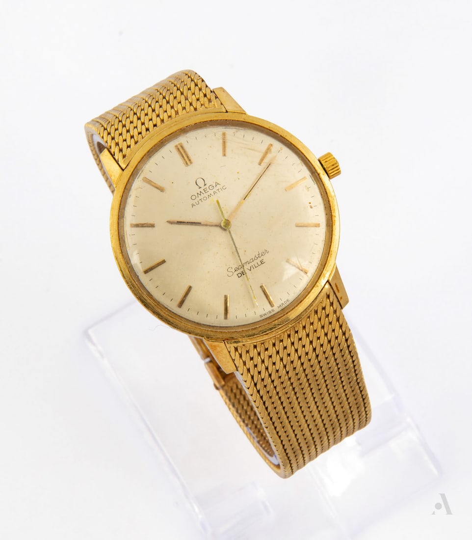 A Vintage Omega Seamaster DeVille 18K Yellow Gold Men's Wristwatch, Switzerland, c. 1960s: A Vintage Omega Seamaster DeVille 18K Yellow Gold Men's Wristwatch, Switzerland, c. 1960s Movement: Automatic, calibre 600 Case: Round 18K yellow gold case, acid tested Dial: Cream with applied baton 