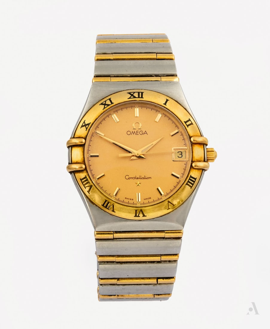 An Omega Constellation Stainless Steel and Gold Men's Wristwatch: An Omega Constellation Stainless Steel and Gold Men's Wristwatch Movement: Quartz Complication: Date Case: Round Stainless steel combined with an 18K gold bezel engraved with Roman numerals Dial: Gold