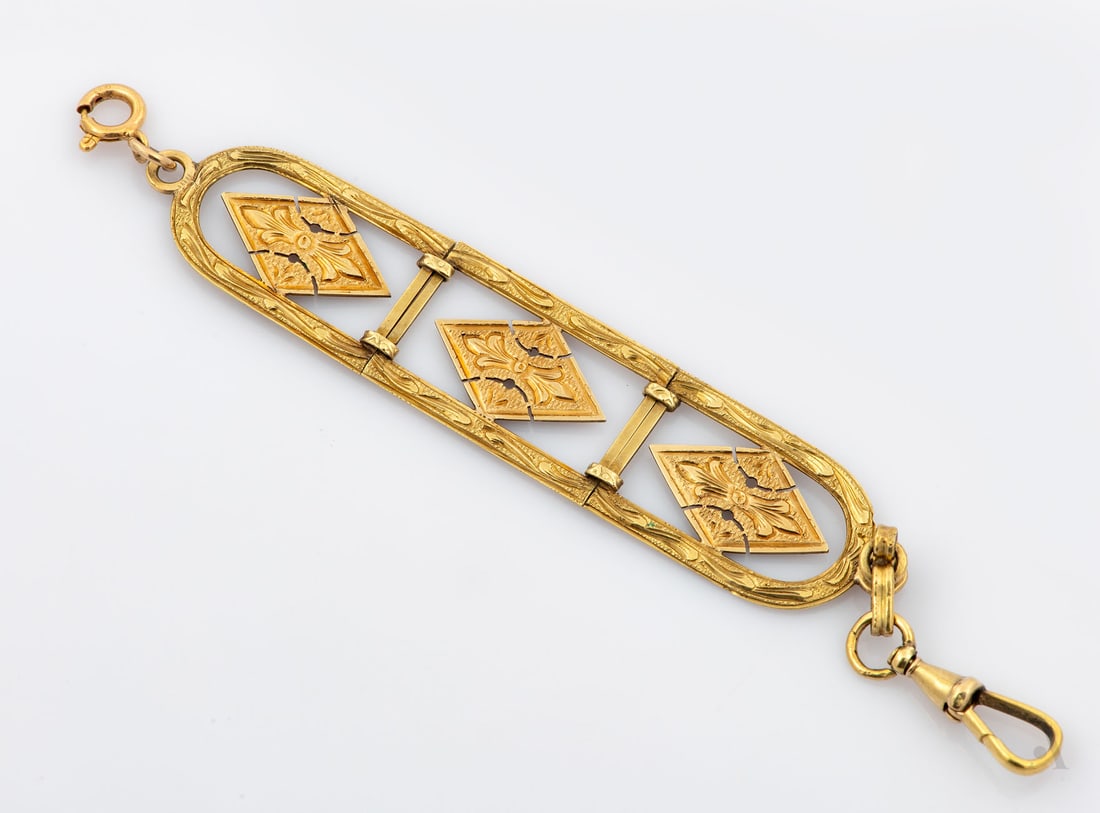 A 14K Yellow and Rose Gold Watch Chain: A 14K Yellow and Rose Gold Watch Chain Decorated with hand pierced work and engraved details. Marked and acid tested. Weight: 6.1 gr; length: 11 cm Condition: For a full condition report please