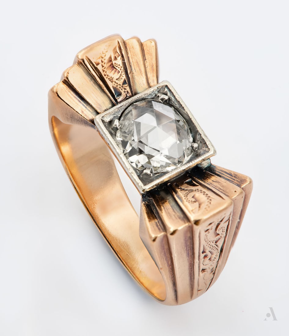 A Retro 14K Rose Gold and Diamond Ring: A Retro 14K Rose Gold and Diamond Ring The head designed as a bow and centered with a rose-cut diamond (approx. 0.5 Ct) flanked by fan-like architectural shoulders engraved with scrolls. Total w