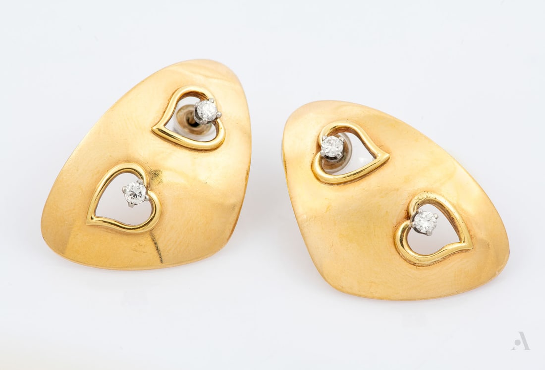 A Pair of 14K Yellow Gold and Diamond Earrings: A Pair of 14K Yellow Gold and Diamond Earrings In a rounded triangular form with cutout hearts studded with tiny diamonds. Marked and gold acid tested. 3 x 2.5 cm; Total weight: 8.5 gr Condition: For 