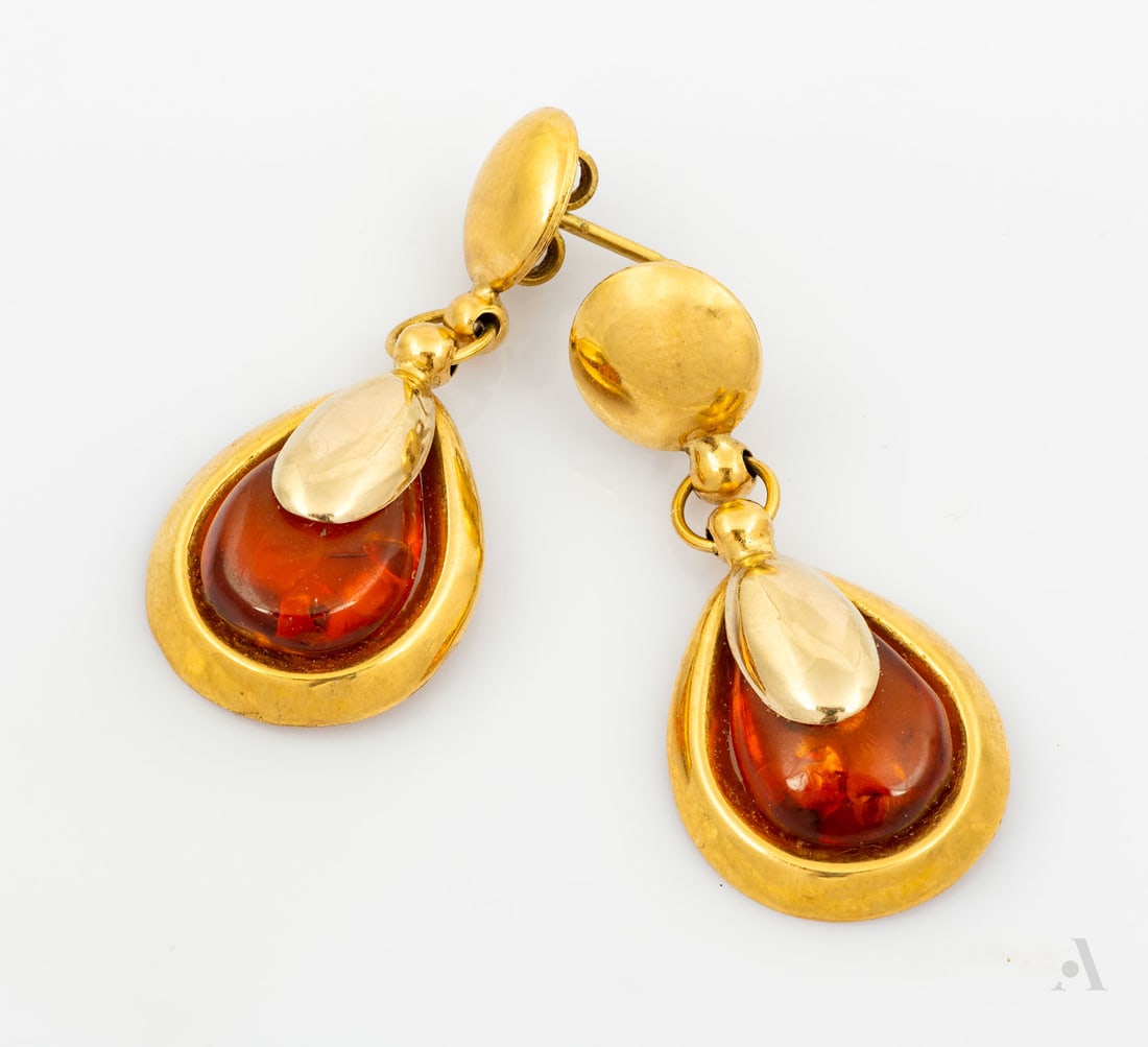 A Pair of 18K Yellow Gold and Amber Earrings: A Pair of 18K Yellow Gold and Amber Earrings A drop shaped gold element fitted with a pear-cut amber and suspended from gold link and topped by a gold circular plate. Marked and gold acid tested. Tota