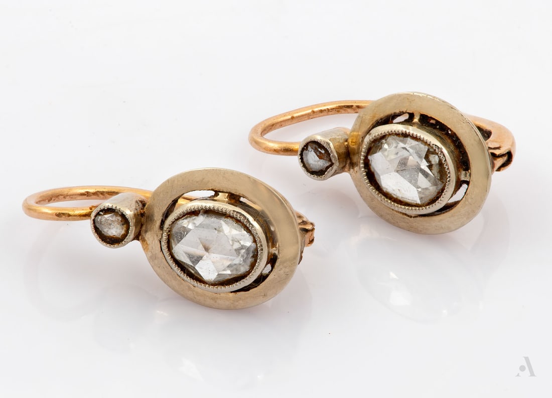 A Pair of 14K Two-Tone Gold Diamond Earrings, Europe, Late 19th Century: A Pair of 14K Two-Tone Gold Diamond Earrings, Europe, Late 19th Century An oval gold element centered by an oval-cut diamond 6.5*4.5mm and surmounted by a smaller diamond. With antiq