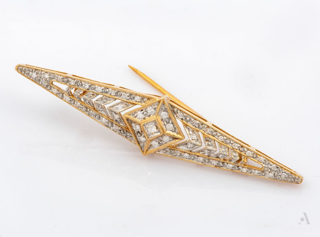 A 14K Two-Tone Gold Diamond Brooch: A 14K Two-Tone Gold Diamond Brooch An elongated rhomboid form set with round-cut diamonds (approx. 0.25 Ct in total). Marked and gold acid tested. Total weight: 5.35 gr; length: approx. 5.5 cm
