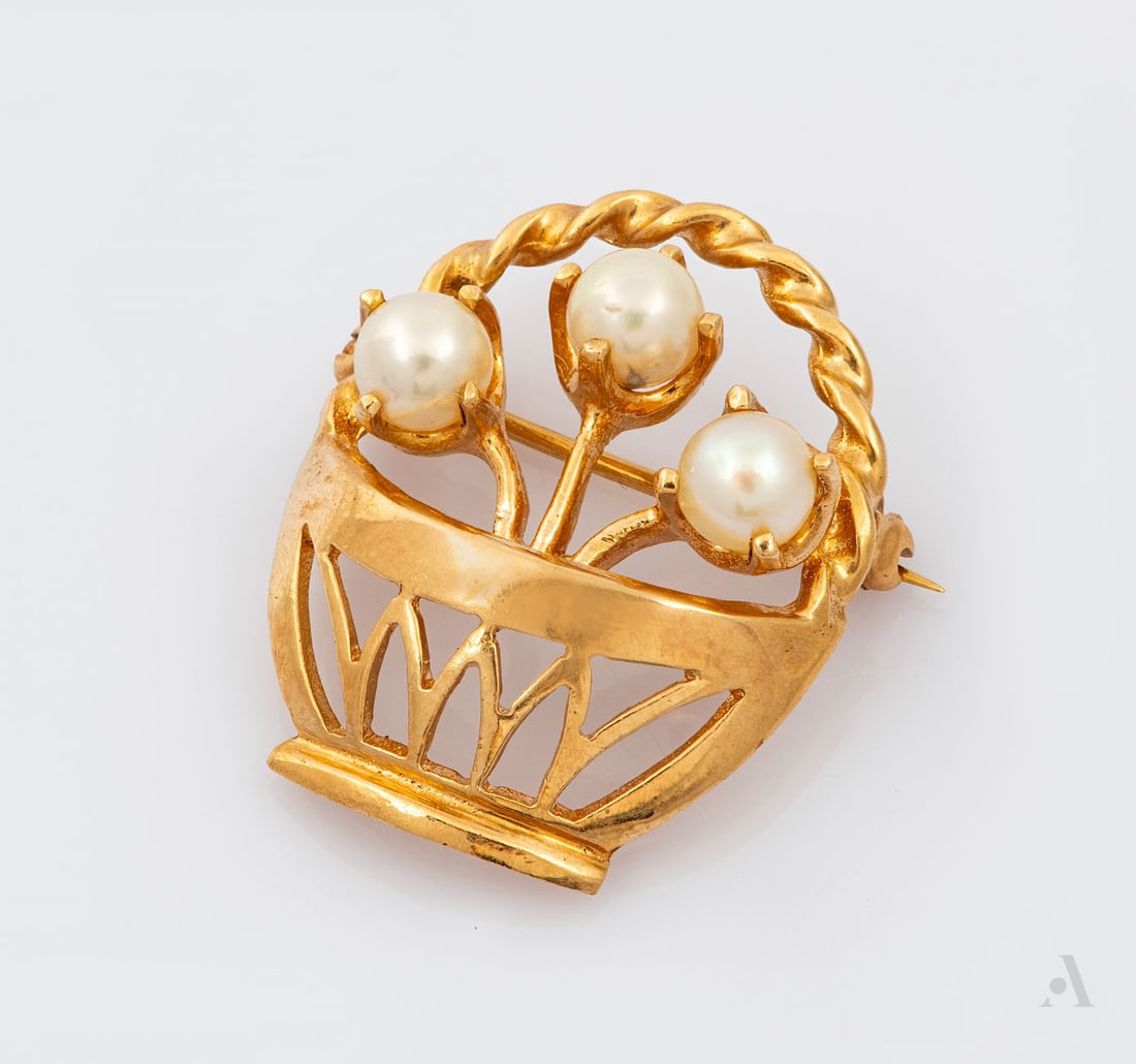 A 14K Yellow Gold and Pearl Brooch: A 14K Yellow Gold and Pearl Brooch Designed as a baset and set with three pearls. Marked and gold acid tested. Length: approx. 2.5 cm; total weight: 4.95 gr Condition: For a full condition report plea