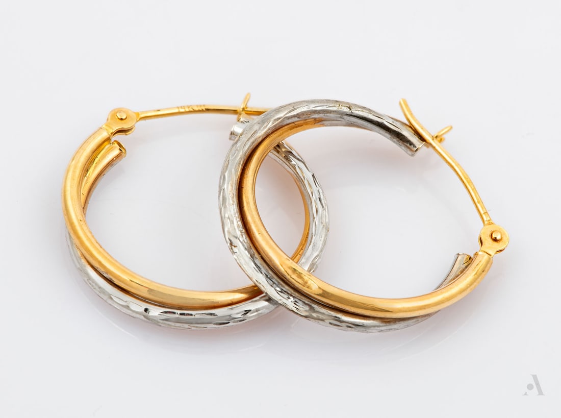 A Pair of 14K Two-Tone Gold Hoop Earrings: A Pair of 14K Two-Tone Gold Hoop Earrings Crafted in 14K two-tone gold. Marked and gold acid tested. Diameter: approx. 10 mm; Total weight: 0.88 gr Condition: For a full condition report please contac