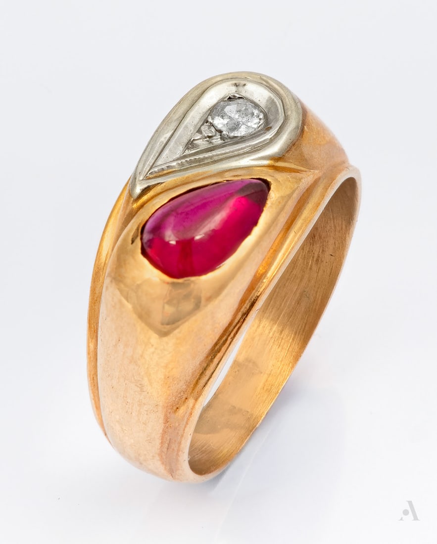 A Toi et Moi 14K Two Tone Gold Diamond and Red Gemstone Ring: A Toi et Moi 14K Two Tone Gold Diamond and Red Gemstone Ring Set with a small round brilliant-cut diamond set in a white gold drop-shaped bezel alongside a pear-shaped cabochon-cut red gemstone. All&n