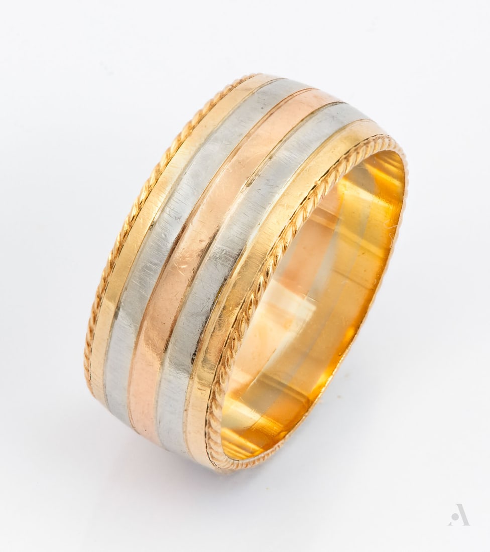 A 14K Three-Tone Gold Wedding Band: A 14K Three-Tone Gold Wedding Band Crafted in 14K yellow, white, and rose gold. Marked and gold acid tested. Weight: 4.85 gr; ring size: 6 Condition: For a full condition report please contact: office