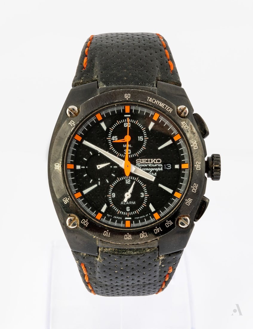 A Seiko Sportura Quartz Chronograph Stainless Steel Wristwatch: A Seiko Sportura Quartz Chronograph Stainless Steel Wristwatch Movement: Quartz Complication: Chronograph, triple date Case: Round stainless steel Dial: Black with white and orange markers Band: Black