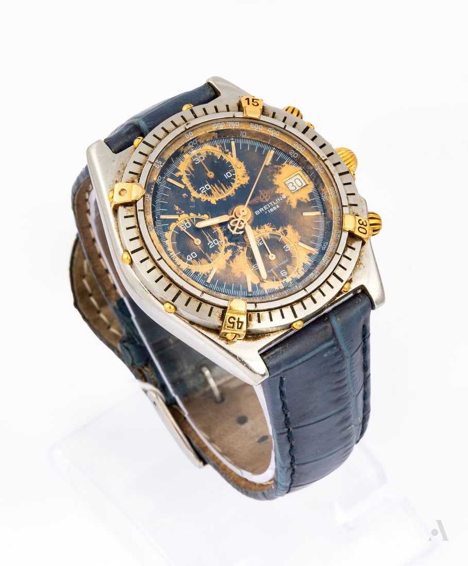 Breitling Chronomat B13047 Stainless Steel and Gold Men's Wristwatch: Breitling Chronomat B13047 Stainless Steel and Gold Men's Wristwatch Movement: Automatic. Complication: Chronograph, date, small seconds. Case: Stainless steel and yellow gold, sapphire crystal. <
