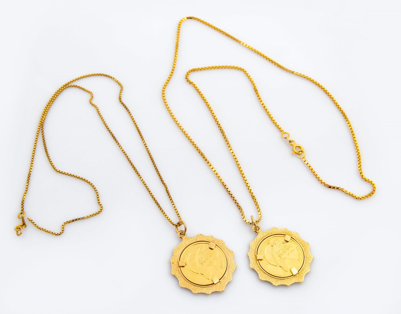 A Lot Comprising Two 14K Gold Coin Pendant Necklaces (1 of 3)