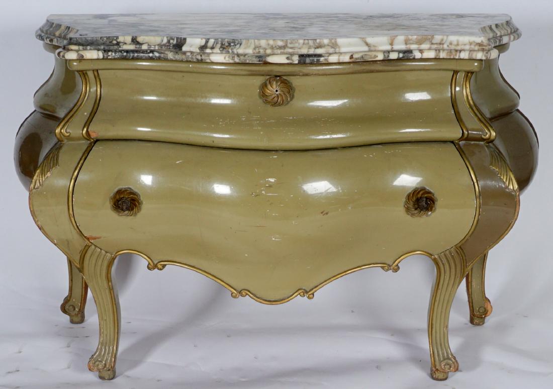 Tony Duquette Style Hollywood Regency Commode: TONY DUQUETTE STYLE HOLLYWOOD REGENCY COMMODE: Serpentine marble top over 2 drawer green painted base with gold accents, carved floral accents under pulls. Overall 37” h. x 60” x 25”. Condition: