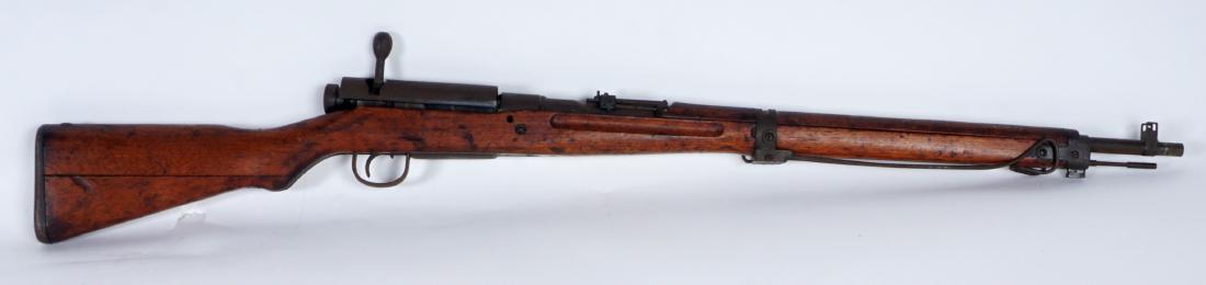 Relic Japanese Arisaka Type 99 WWII Rifle: RELIC JAPANESE ARISAKA TYPE 99 WWII RIFLE: Bolt action, 7.7 mm barrel, breech with dust cover, typical Japanese markings, action frozen, overall 44” long. Sold with the bayonet and metal sheath. Con