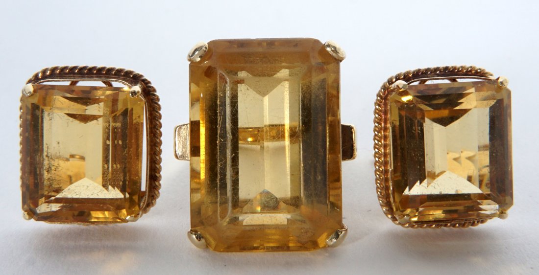 14k Gold Citrine Ring and Earring Suite: 14K GOLD CITRINE RING AND EARRINGS SUITE: 3 matched pieces total to include 1) 14k yellow gold ring marked Kimberly, approx. 23 ct. center emerald cut citrine, 22mm x 15.5mm x 10mm, size 7.5. 2-3) Mat