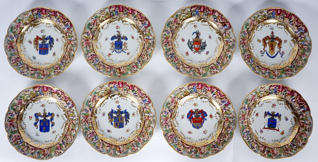 8 Capodimonte Armorial Dinner Plates: 8 CAPODIMONTE ARMORIAL DINNER PLATES: Each with a scalloped relief Bacchanalian scene rim and a different armorial / heraldic crest in center. Blue Capodimonte crown over “N” mark, 10 ¼” dia. C