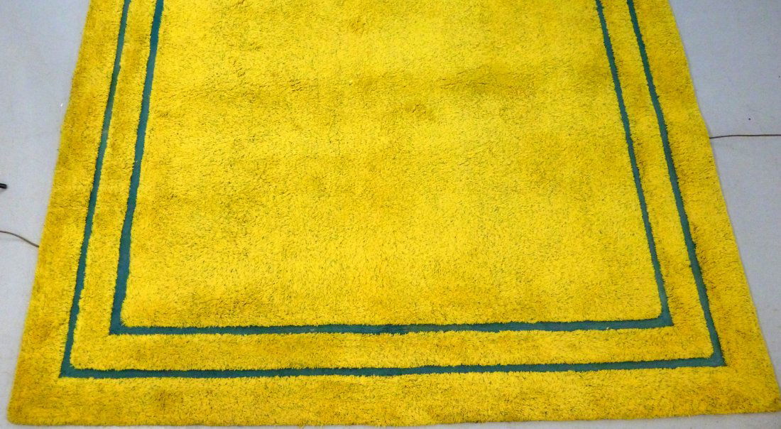 Edward Fields Modernist Carpet 10' X 14' 2": EDWARD FIELDS MODERNIST CARPET 10' x 14' 2": Signed Edward Fields wool rug, mottled yellow and green pile, 2 teal bands. Condition: Stain and older repair noticeable from back. Does not detract from t