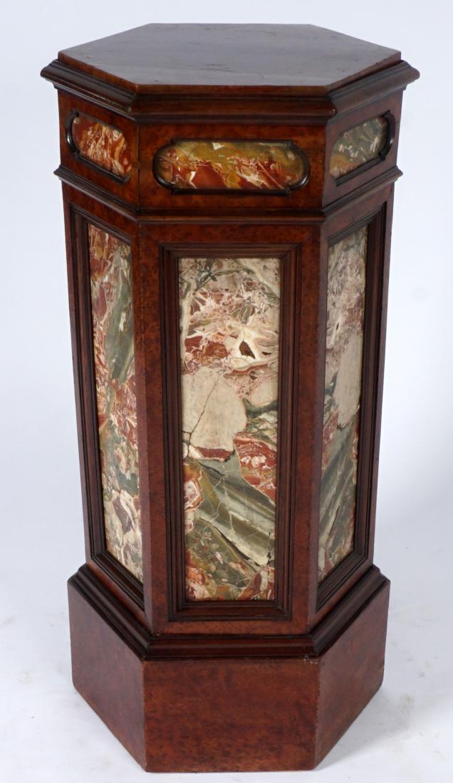 Marble Sided Pedestal / Plant Stand: MARBLE SIDED PEDESTAL / PLANT STAND: Hexagonal form pedestal, burl veneer, each side with marble inserts, 36" h. x 15 1/4". Condition: Wear consistent with age and use.