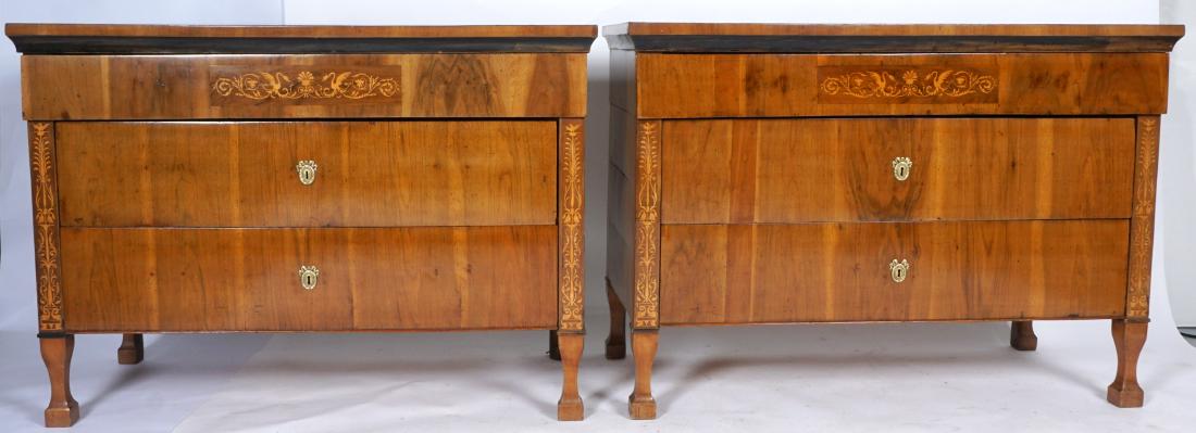 Pair Continental 3 Drawer Inlad Commodes: Most likely Austrian, circa 1800, full length top drawer with fruitwood swan and foliate scroll panel, over 2 deep drawer. Inlaid stiles, shaped feet, overall 37.25" h. x 51.75" x 24.5". Purchased by