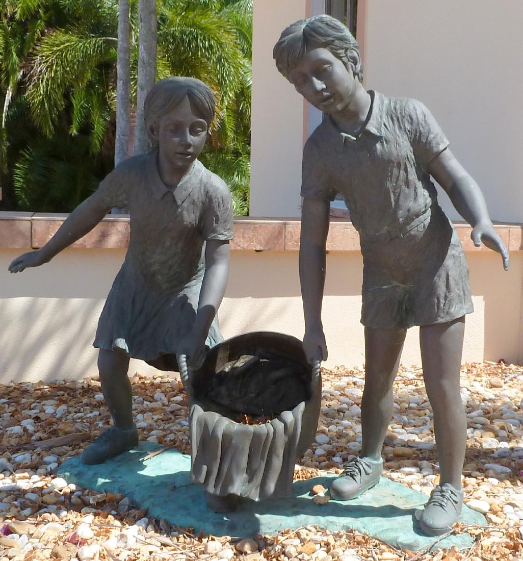 Bronze Garden Sculpture Children with Wash Bucket: Figural group of 2 children holding a wash bucket (Jack & Jill?), signed Liam Baptiste on base. Fitted as a fountain however spout has been plugged. Measures 43.5" h. x 52" x 17". Condition: Weatherin