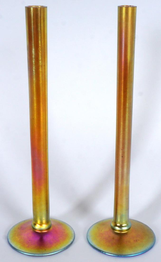 Pair Steuben Aurene Stick Bud Vases: Gold iridescent art glass bud vases, marked on base Steuben Aurene 2556, 10" h. x 3" base dia.