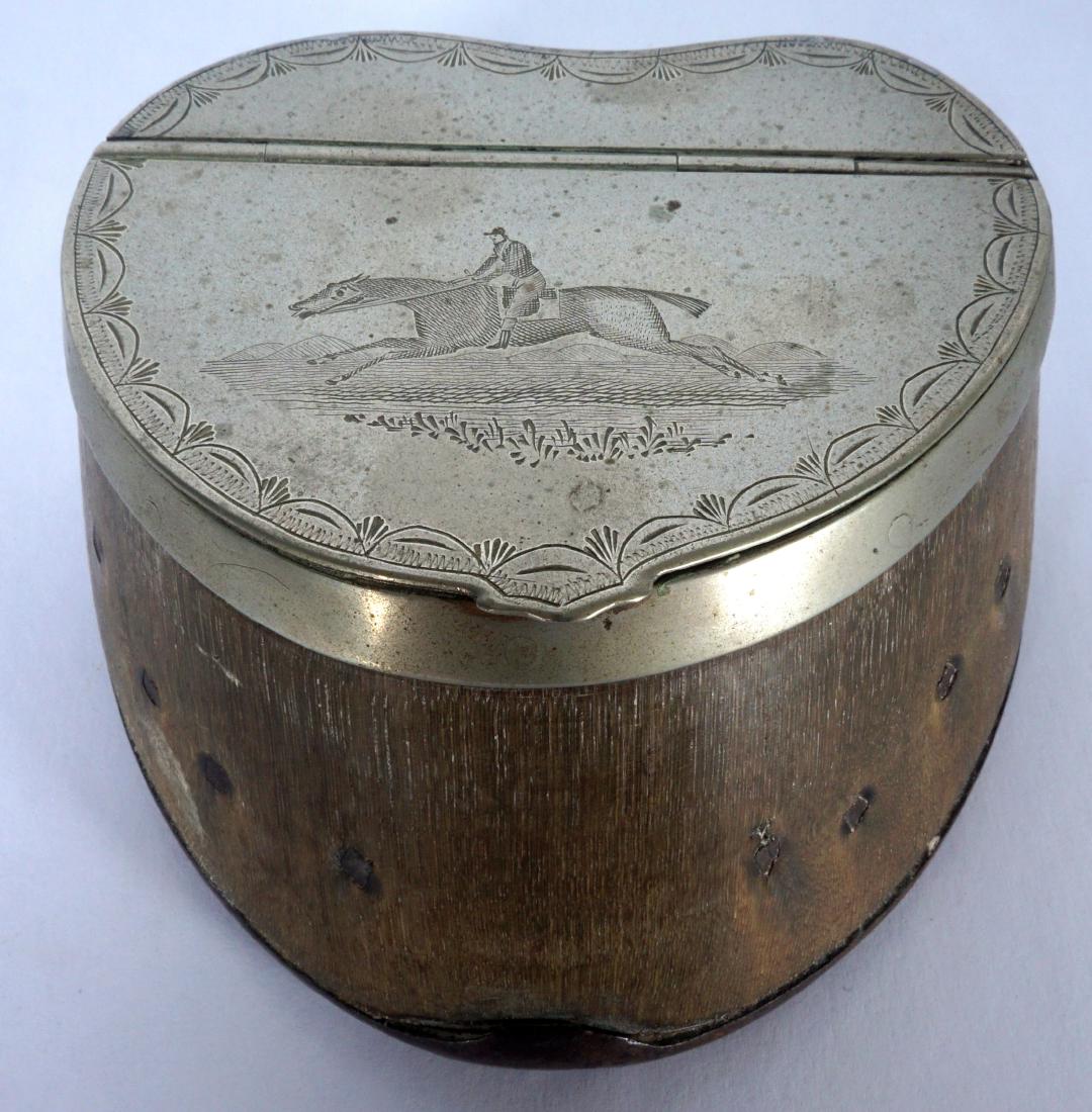Silverplate Mounted Horse Hoof Inkwell: Hinged lid with engraved horse and rider mounted to horse hoof, attached horseshoe. 2" h. x 4" x 3.75".