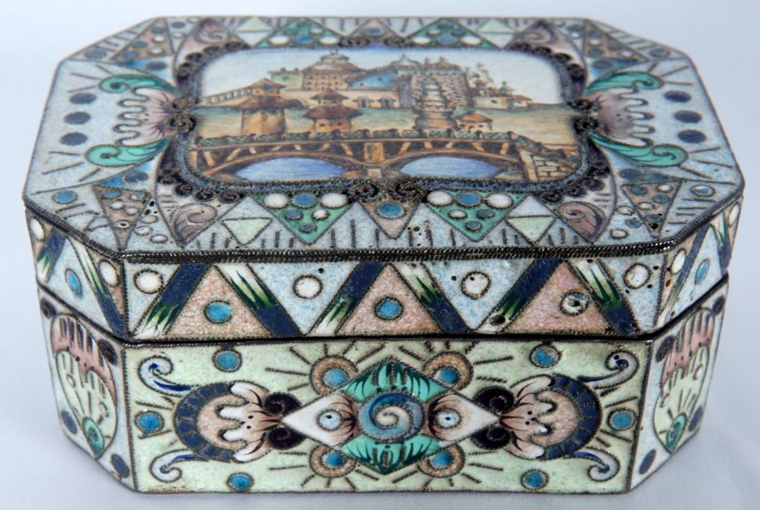 Russian Silver Enameled 20th Artel Snuff Box: Hinged lid with center enameled town scene , balance with enameled foliate and geometric designs. Marked on base with 20th Artel and Moscow town marks. 1.25" h. x 3" x 2", approx. 5.3 troy oz.