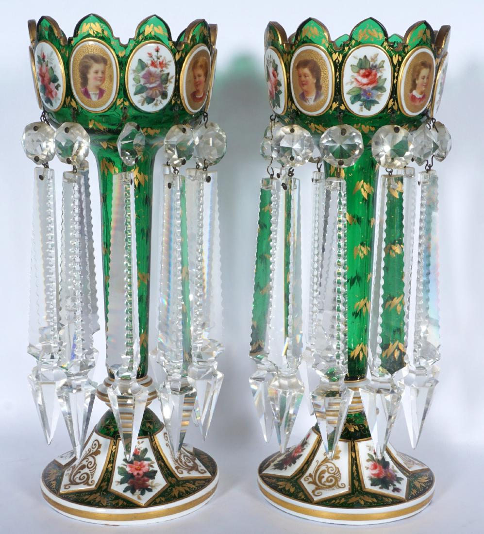 Pair Green Bohemian Glass Lusters: Top bowl with alternating enamel portrait and floral medallions tapered shaft, splayed foot with floral and gilt decoration, clear cut glass prisms, 11.25" h. x 4.25". Condition: The occasional chip t