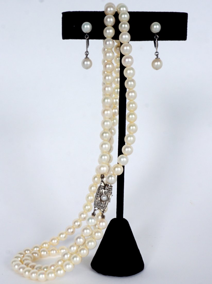 Mikimoto Pearl Suite Necklace and Earrings: To include 1) Double strand of approx. 5.5mm pearls, clasp marked with Mikimoto bag mark, unknown metal mark S.I. approx. 14 1/4" long. 2) Screwback earrings, each with 2 approx. 5..0 mm pearls, unmar