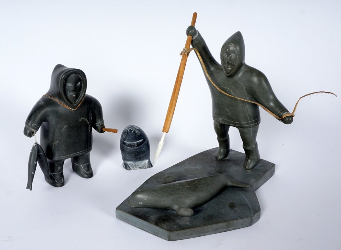 Three 20th Century Inuit Soapstone Carvings: 3 pieces total to include 1) Figural group of whale hunter with removable harpoon and whale on base. No visible signature or markings, 7” h. x 4 1/2” x 7 ½”. 2) Figure of a fisherman holding 2