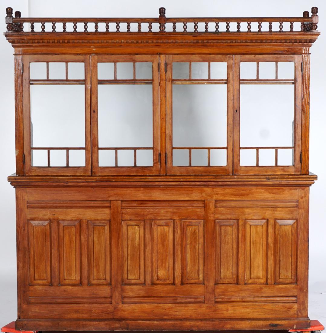 Circa 1900 Oak 4 Window Postal Station: Turned stick and ball gallery over 4 original wavy glass windows opening outward, shaped paneled supports. Base with 7 graduating center drawers, surmounted either side with slide out shelf over singl