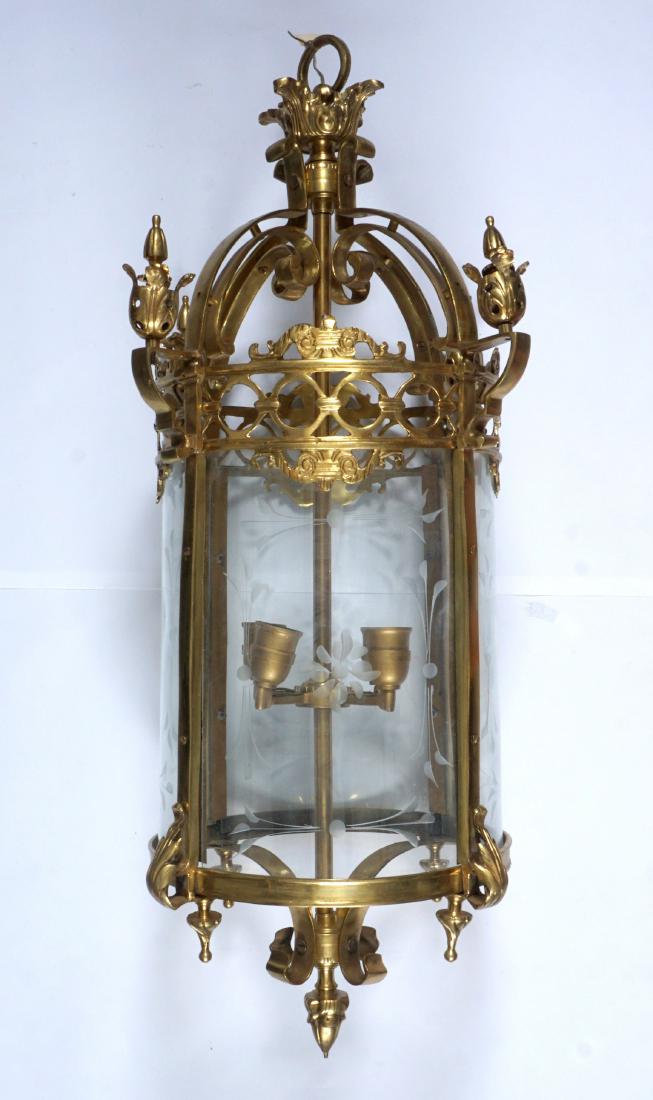 French Bronze & Brass Hanging Lantern: Cast gilt bronze and brass frame, floriform finials and foliate accents. Curved etched glass panels, 4 socket fixture, 36.5" h. x 17" dia.