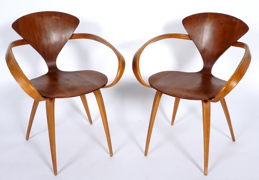 Pair Norman Cherner Bent Wood Arm Chairs: Circa late 1950's, Norman Cherner for Plycraft, "Pretzel" bent wood arms, walnut veneer, missing labels. 31.25"h. x 24.75 x 22.5". Condition: Water stains, one missing several screws underneath.