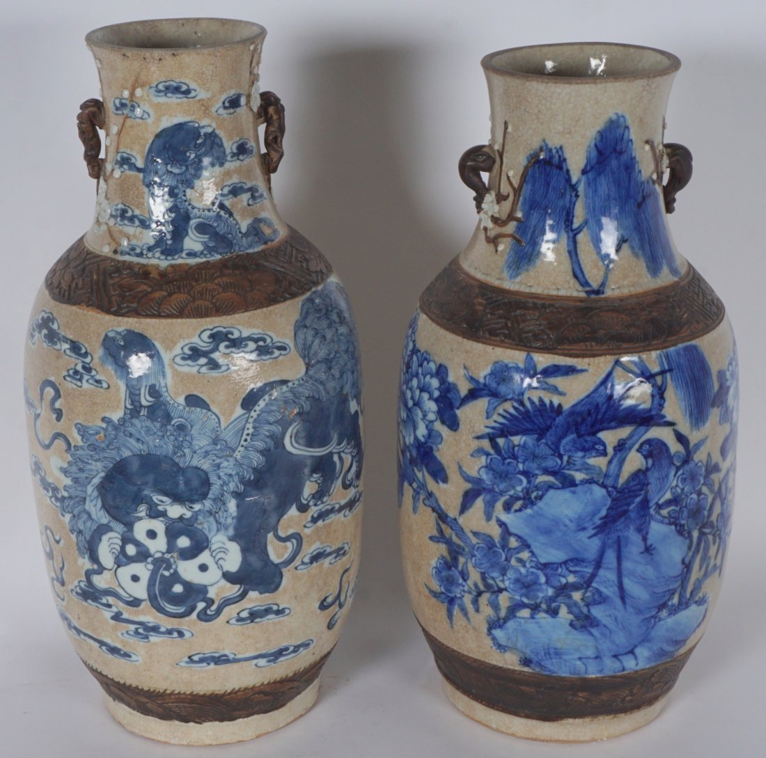 Pair Chinese Blue & White Crackle Glaze Vases: Baluster form vases with applied branch form handles, crackle glaze ground, incised bands, blue and white birds in branches decoration. Incised mark on base with red wax export seals, 16.5” h. x 7.7