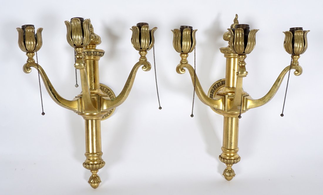 Pair Gilt Bronze 3 Arm Gasolier Wall Sconces: Circa 1875, electrified, cast brass flame finial, 3 arms with floriform bobeche surrounding each fixture. Overall 20" h. x 13.75" x 14". Condition: Spotting to brass.