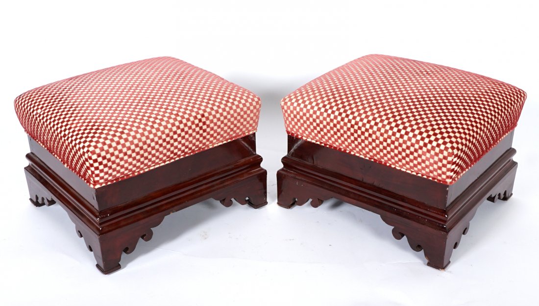 Pair Mahogany English Foot Stools: Red and white checkerboard upholstered top, mahogany base with sculpted bracket feet. Overall measure 13.75" h. x 18" x 18". Condition: Veneer bubble and chips.