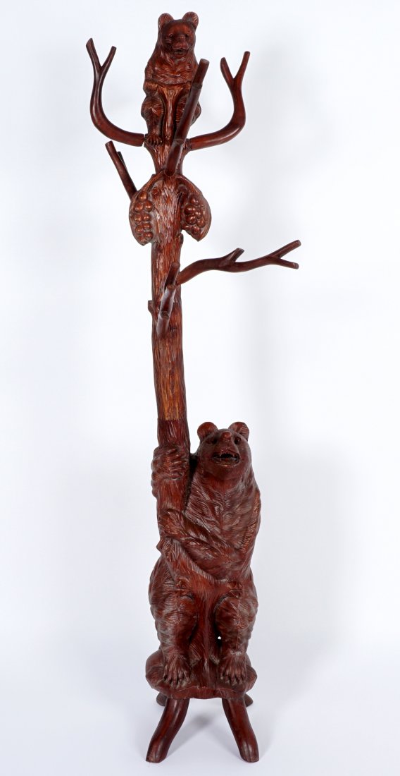 Black Forest Style Carved Bear Coat Rack: 20th Century, figure of standing bear at base, cub at top, 7 removable branches, 72" h. Condition: Age split to lower bear.