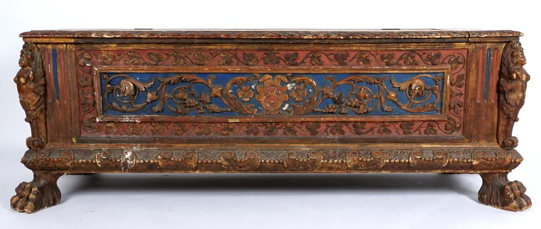 18th Century Italian Carved and Painted Cassone: Polychrome paint decorated all over, hinged lid top with engraved carved grape vine and medallions. Front foliate scroll panel with shield center bordered by wines, oval medallions on either side, all