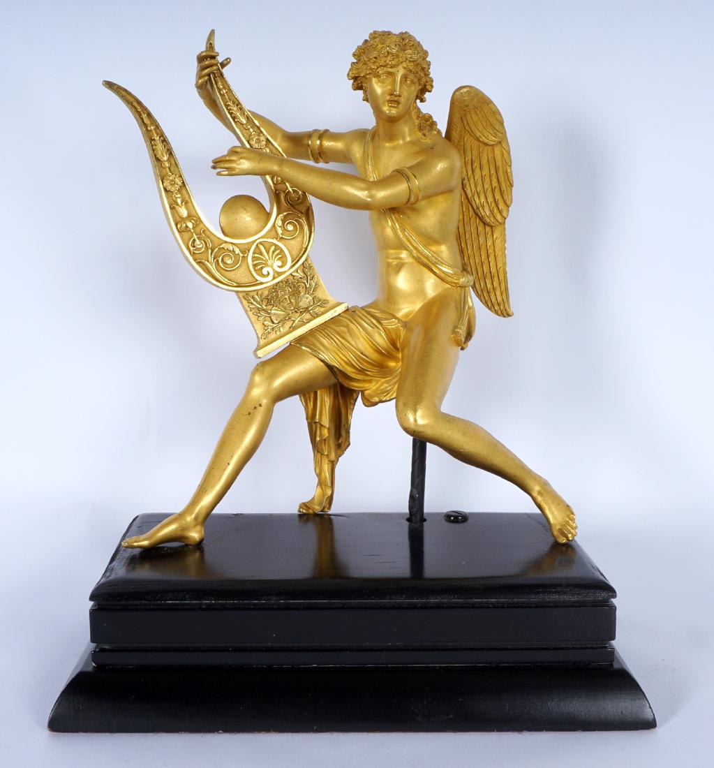 French Bronze Dore Figure of Apollo with Lyre: Early 19th Century, gilt bronze figure of Apollo holding a lyre, no visible marking. Figure measures 12.25" x 11" x 6.5". Affixed to wood plinth, overall with plinth 15.5" h. x 13" x 7.5"