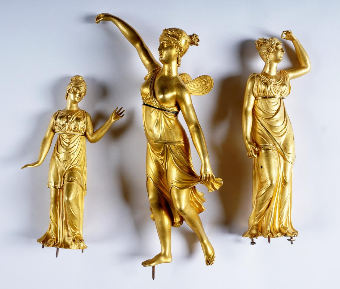 Three Bronze Dore Figural Maidens: Early 19th Century, an assembled collection of three gilt bronze maidens, graduating in size, largest with wings. Most likely figures for mantle clock or garniture sets. Largest measures 12" h. exclud