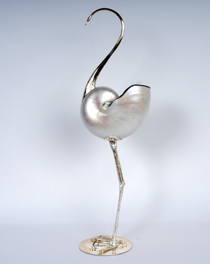 Gabriella Binazzi Silverplate & Seashell Crane: Designed by Gabriella Binazzi for Oggetti, crane or stork with silverplate head, neck, legs, and base. Seashell body with silverplate trim. 22.5" h. x 5.5" x 6.5". Condition: Minor loss of silverplate