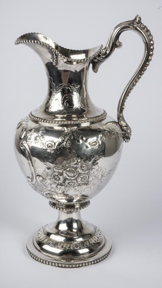Savage & Lyman Canadian Sterling Silver Pitcher: Mid 19th Century impressive sterling silver pitcher made by Savage & Lyman Montreal, beaded spout and rim, scroll handle with bellflowers and ending in figural eagle bust. Embossed and engraved balust