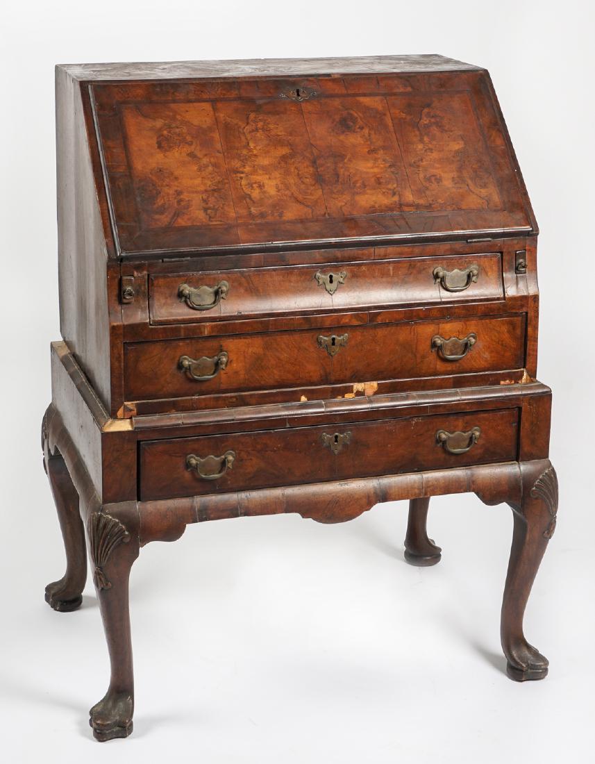 Queen Anne Style Burl Veneer Slant Front Desk: Late 19th Century Queen Anne style, burl veneer top and front. Slant front opens to fitted interior with prospect door, drawers, and pigeon holes. 3 full length drawers, Queen Ann legs carved at knees