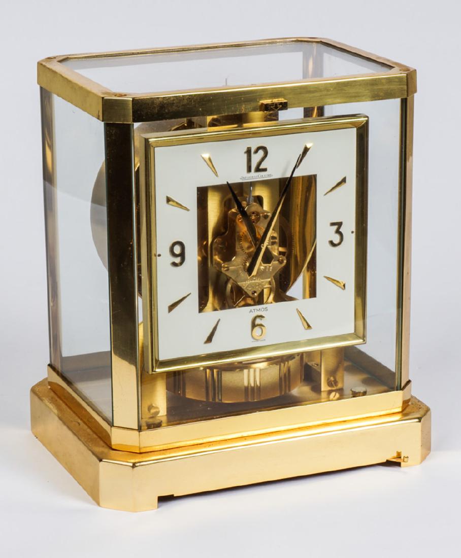 1970's Jaeger-LeCoultre Atmos Clock: Brass case, white square dial with Arabic numerals and hashmarks, serial number 408279 dates to early 1970's, currently running however not guaranteed to continue running or keep accurate time. Overal