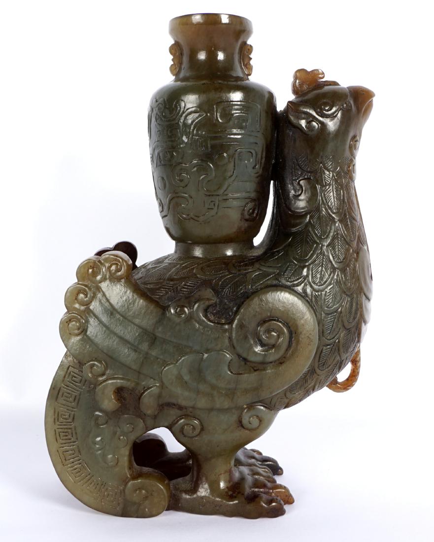 Chinese Carved Jade Phoenix with Urn Censer: Dark green and russet jade or similar stone figural phoenix with urn on its back, overall 7.5" h .x 5.25".